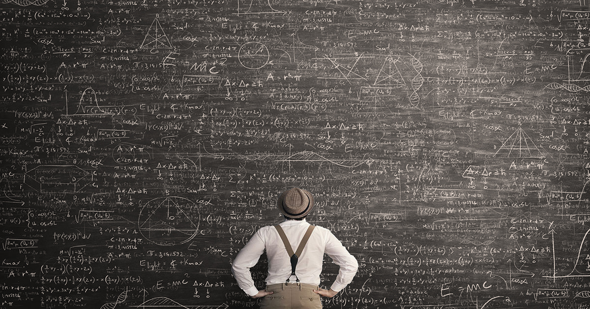Man standing thinking on how to solve the math problem
